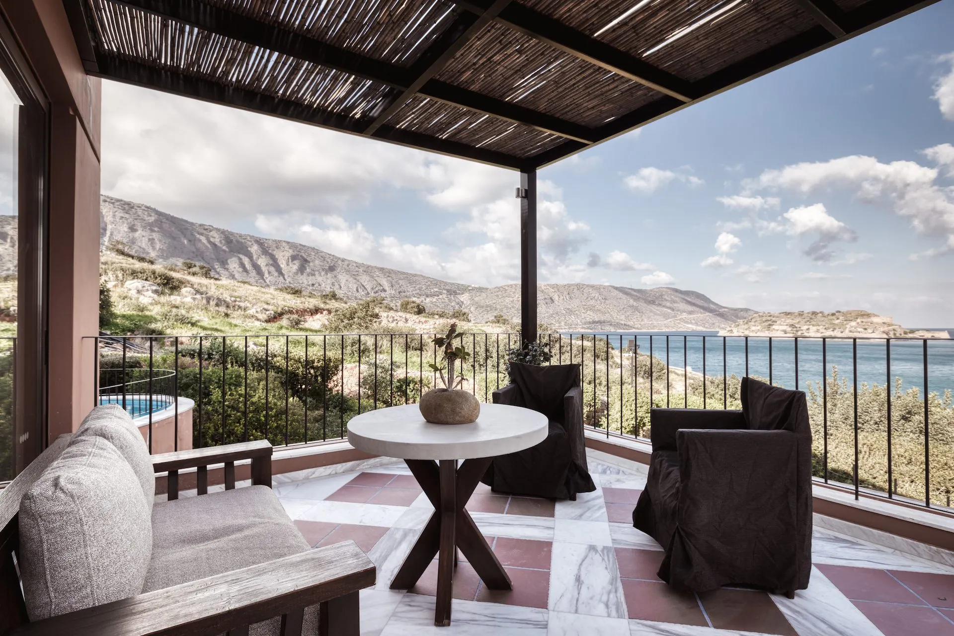 Domes of elounda premium suite outdoor sitting area